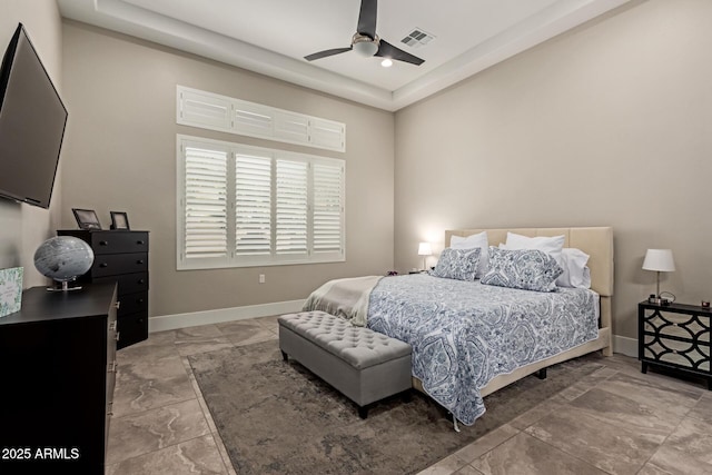 bedroom with visible vents, baseboards, and a ceiling fan