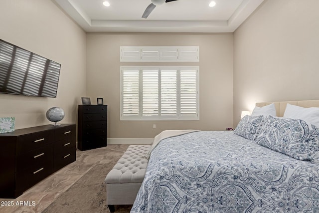 bedroom with baseboards and a ceiling fan