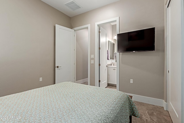 bedroom with baseboards and visible vents
