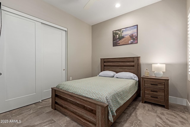 bedroom with recessed lighting, a closet, and baseboards