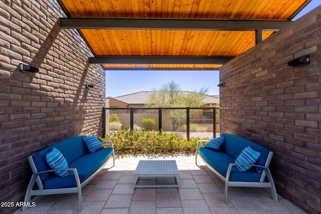 view of patio / terrace featuring an outdoor living space and fence