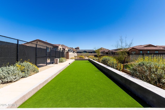view of yard with a residential view and fence