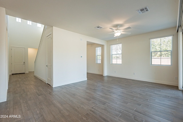 empty room featuring wood-type flooring and ceiling fan