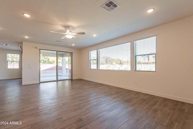 empty room featuring dark hardwood / wood-style floors and ceiling fan