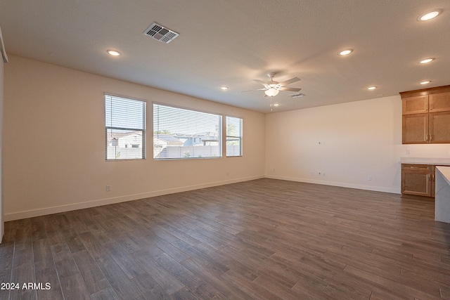 interior space with ceiling fan and dark wood-type flooring