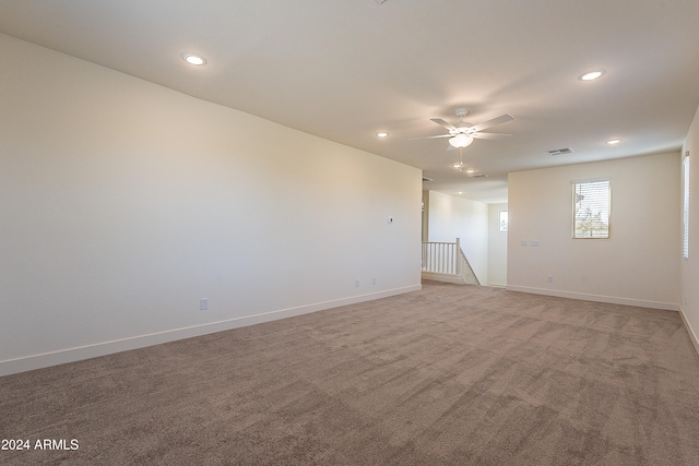 carpeted empty room with ceiling fan