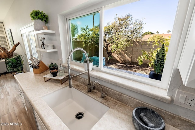 bathroom featuring hardwood / wood-style flooring and sink