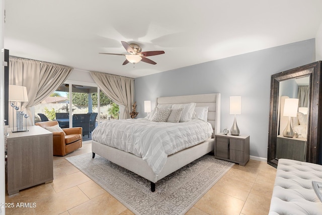 tiled bedroom with ceiling fan and access to exterior