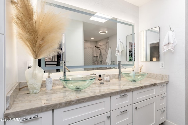 bathroom featuring vanity and a tile shower