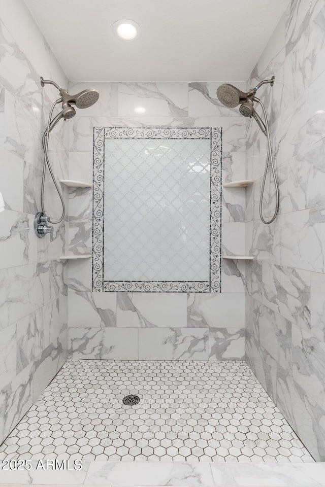 bathroom featuring tiled shower