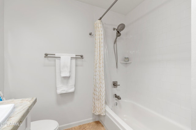 full bathroom featuring toilet, vanity, and shower / bathtub combination with curtain