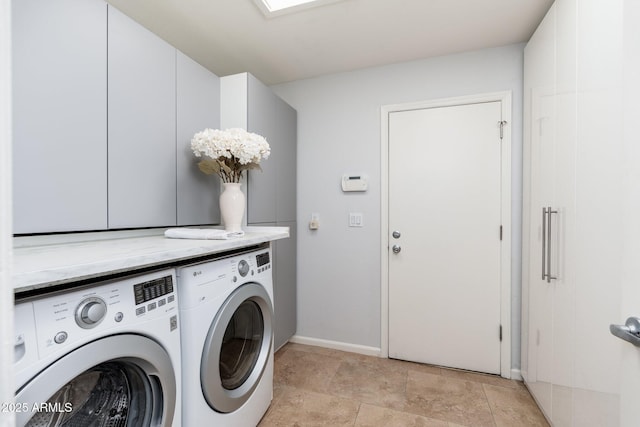 laundry area featuring cabinets and independent washer and dryer