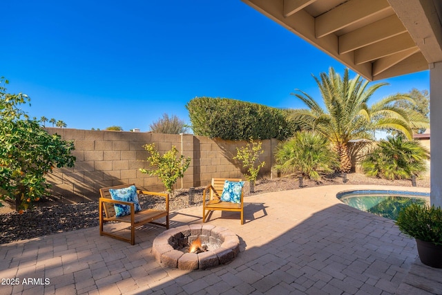 view of patio featuring an outdoor fire pit