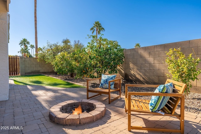 view of patio / terrace featuring an outdoor fire pit