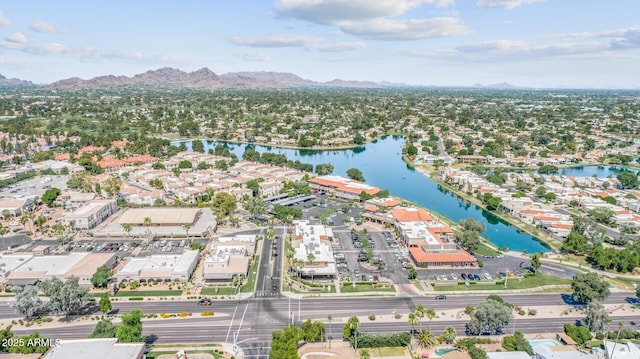 drone / aerial view with a water and mountain view