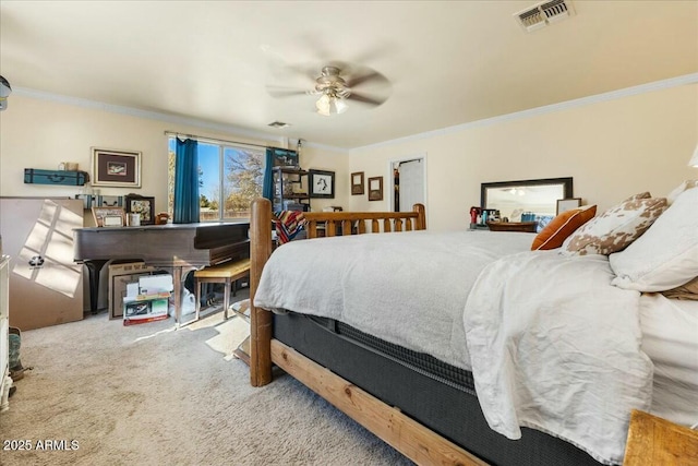 bedroom with ceiling fan, ornamental molding, and carpet flooring