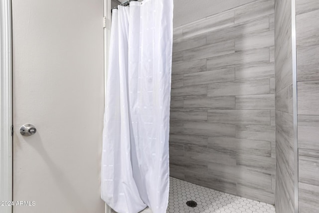 bathroom with a shower with curtain