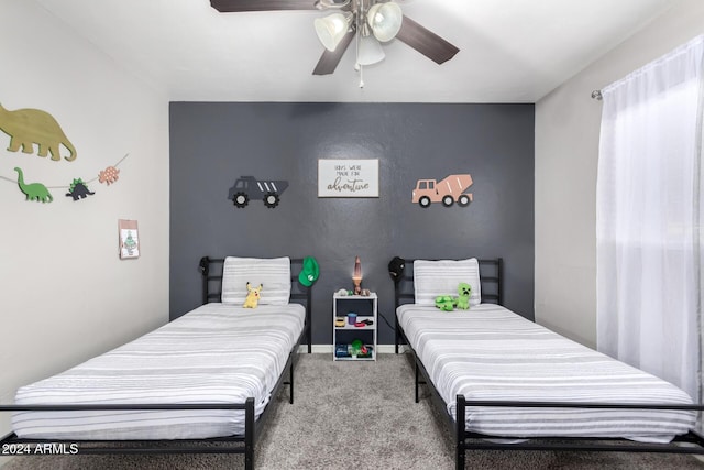 carpeted bedroom featuring ceiling fan