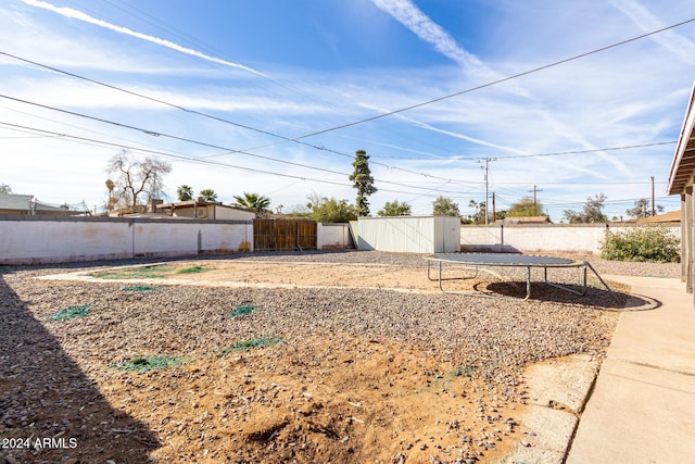 view of yard featuring a trampoline