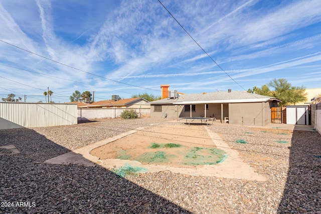 back of property with a patio