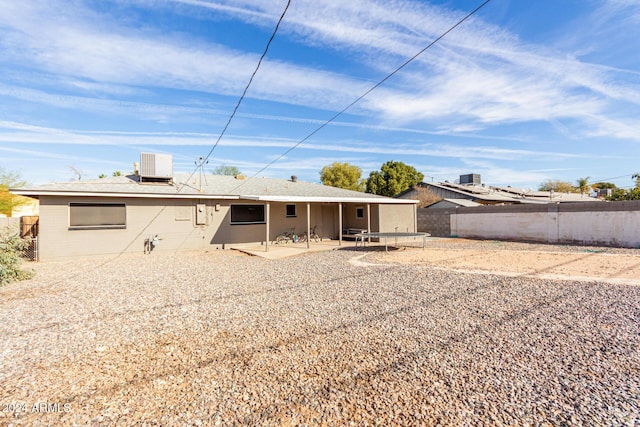 back of house featuring a patio area and central air condition unit