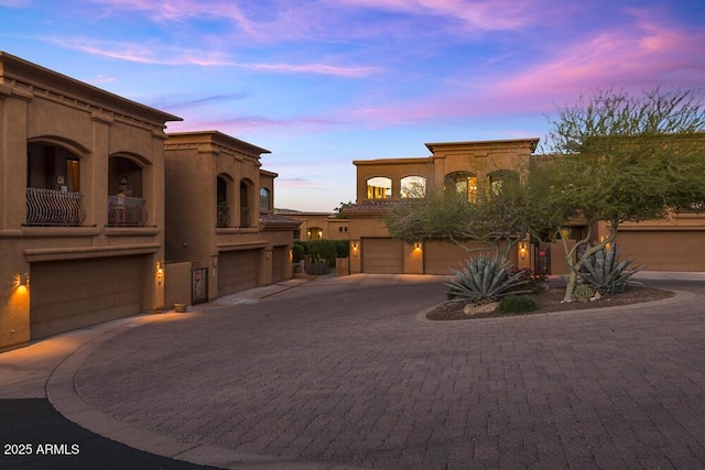 7199 E Ridgeview Pl Unit 221, Carefree, AZ 85377 - mediterranean / spanish-style house with a garage, stucco siding, and driveway