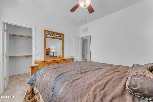 bedroom with ceiling fan and a closet