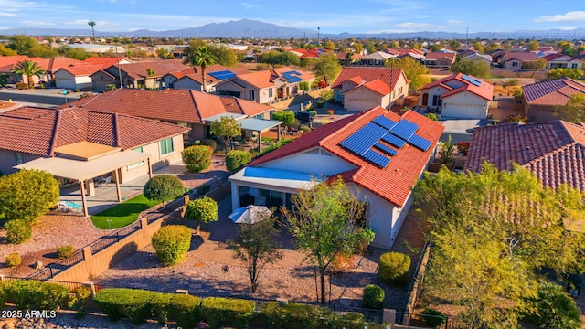 birds eye view of property with a mountain view