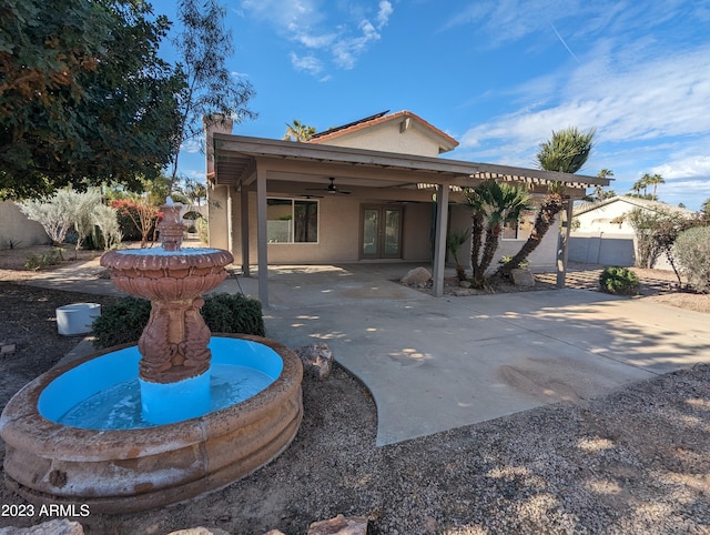 view of home's exterior with ceiling fan and a patio area