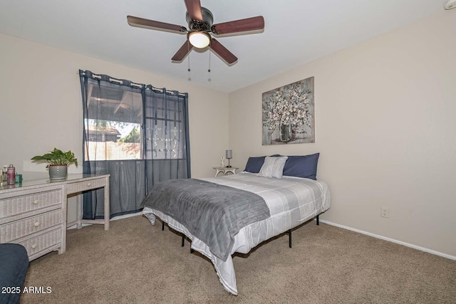 carpeted bedroom with a ceiling fan and baseboards