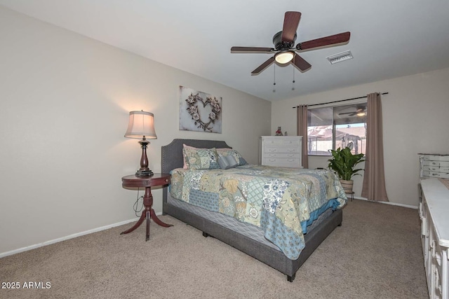 carpeted bedroom featuring baseboards, visible vents, and ceiling fan