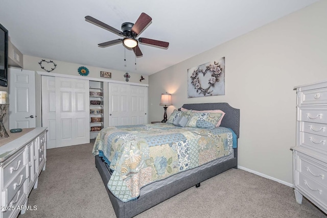 bedroom with a closet, carpet flooring, ceiling fan, and baseboards