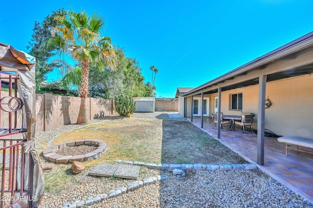 view of yard with a patio and a fenced backyard