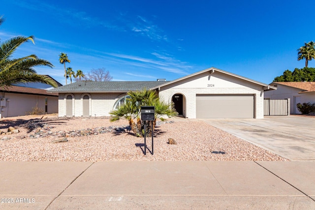 ranch-style home featuring a garage