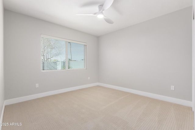 carpeted empty room with ceiling fan