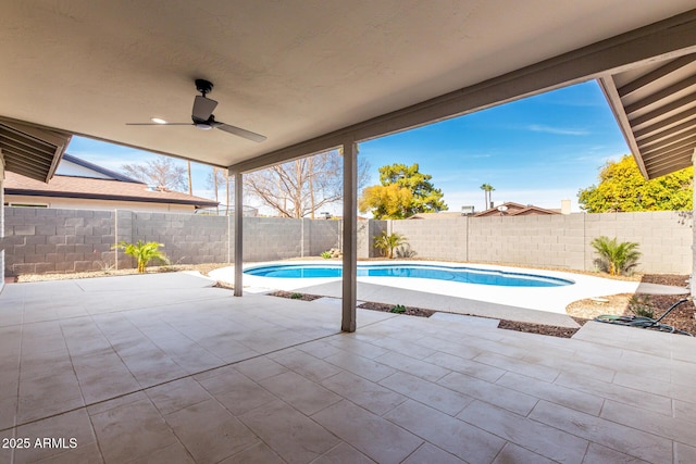 view of pool with a patio and ceiling fan