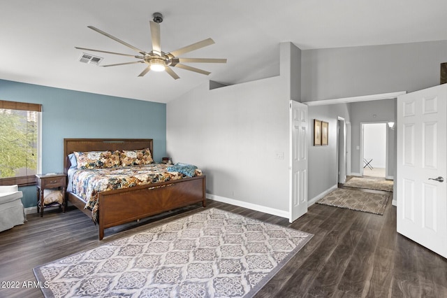 bedroom featuring dark wood-type flooring, vaulted ceiling, and ceiling fan