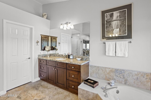 bathroom with tile patterned floors, vanity, and separate shower and tub