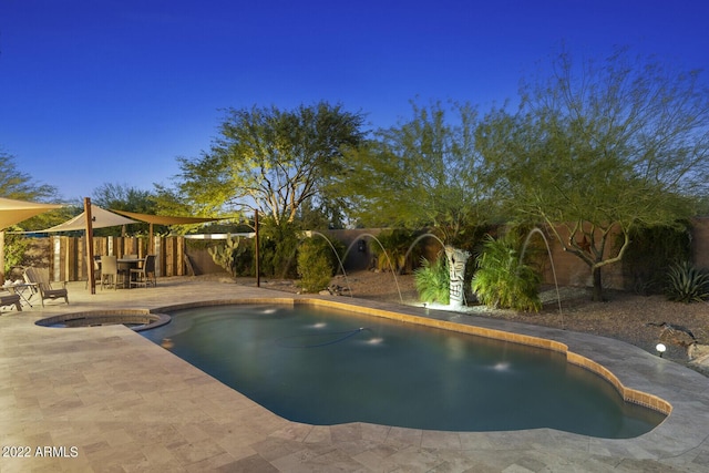 view of swimming pool featuring pool water feature and a patio area