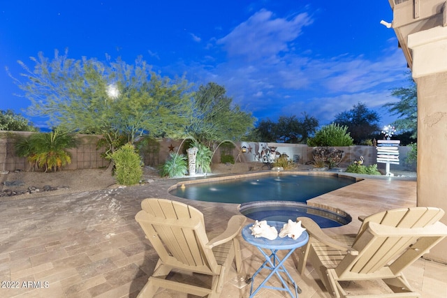 view of pool featuring an in ground hot tub and a patio area