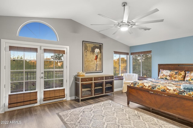 bedroom featuring lofted ceiling, wood-type flooring, french doors, and ceiling fan