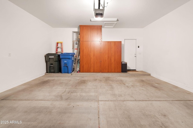 garage featuring baseboards and a garage door opener