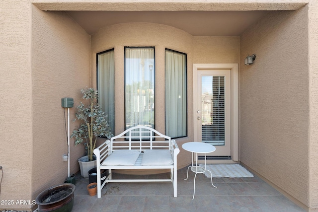 property entrance featuring stucco siding