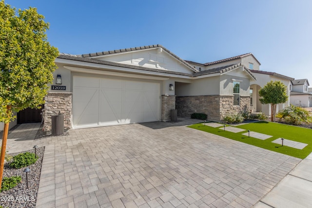 view of front of property with a garage and a front yard