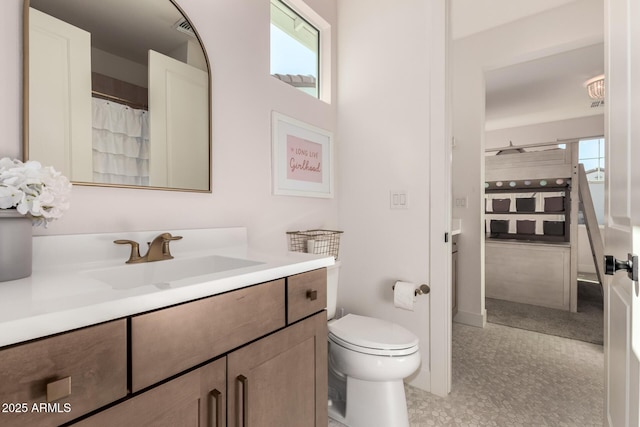 bathroom with vanity and toilet