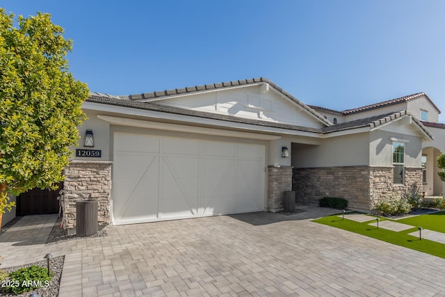 view of front of property with a garage