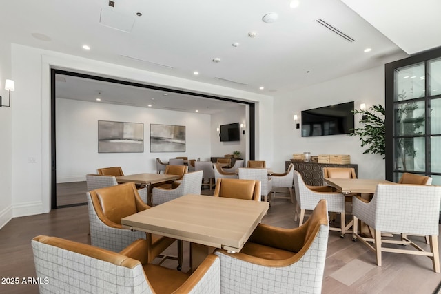 dining area with hardwood / wood-style flooring