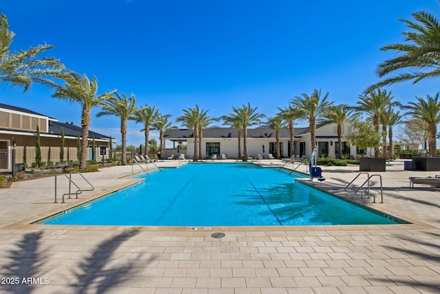 view of swimming pool featuring a patio area