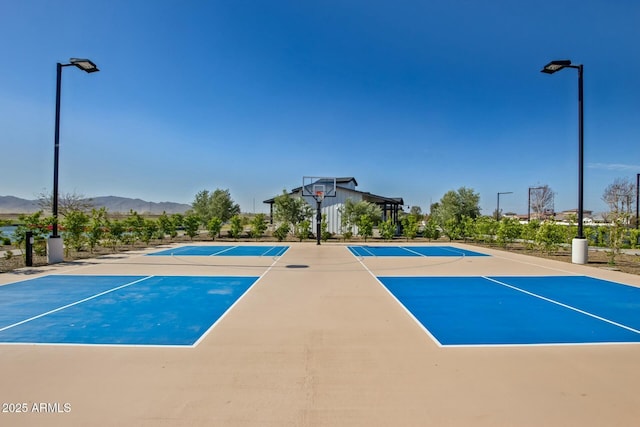 view of sport court with a mountain view