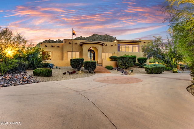 35824 N Tom Darlington Dr, Carefree, AZ 85377 - view of front of house featuring stucco siding and curved driveway